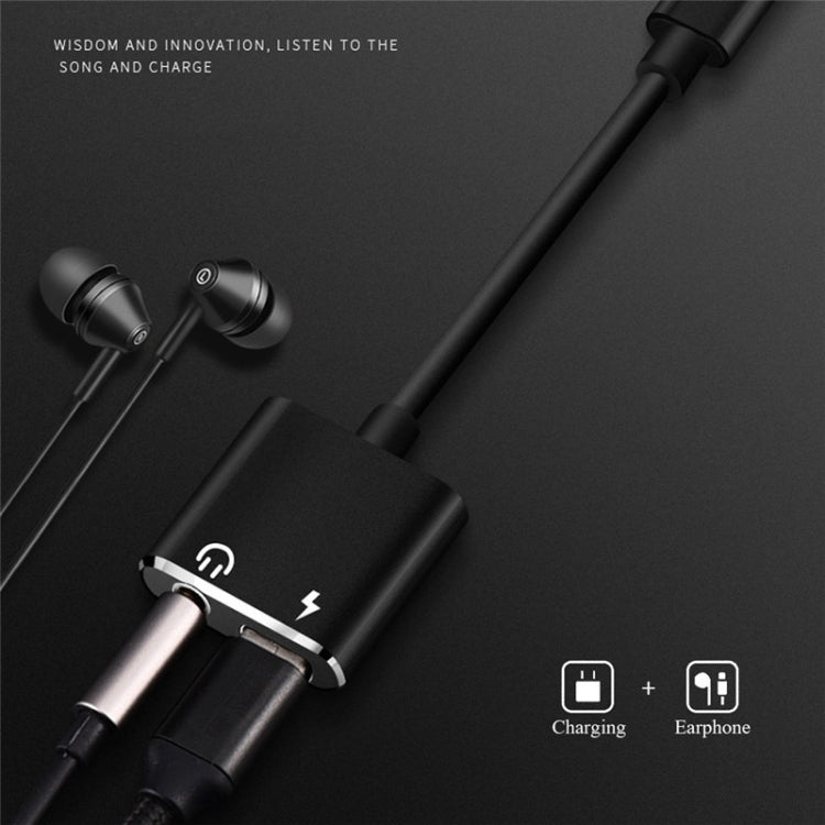 Black USB-C audio adapter with 3.5mm earphone jack and USB-C charging port