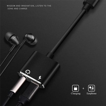 Black USB-C audio adapter with 3.5mm earphone jack and USB-C charging port