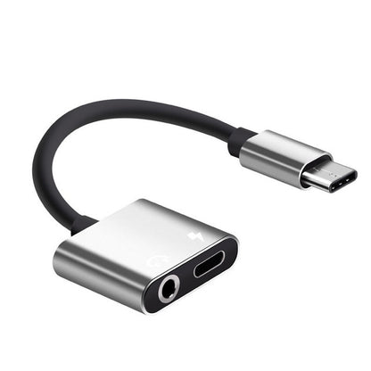 Silver USB-C to 3.5mm aux and USB-C charging adapter audio cable with black cord