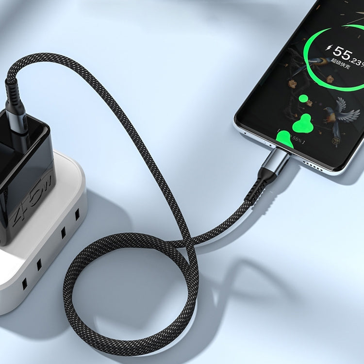 Black braided Type-C to Type-C cable connected to a power adapter