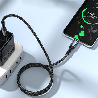 Black braided Type-C to Type-C cable connected to a power adapter