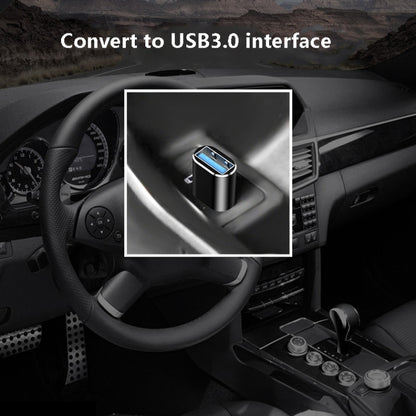 USB 3.0 to USB-C OTG adapter in a car setting, showing blue USB interface