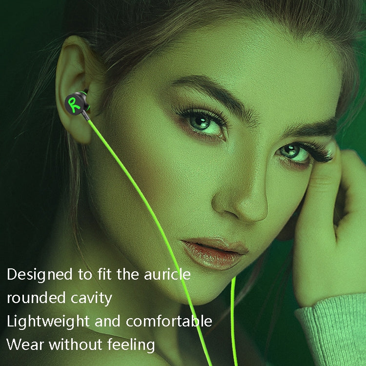 Worn in-ear earbuds with green cable, designed for lightweight comfortable fit