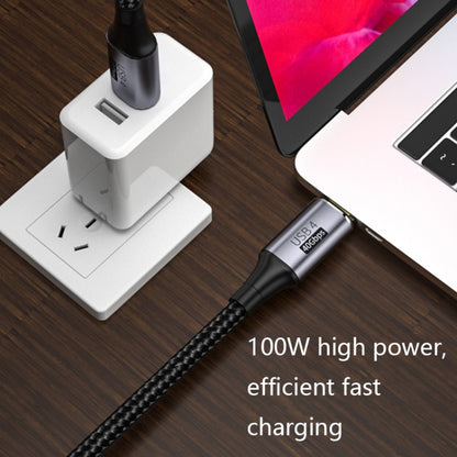 USB-C to USB-C braided charging cable connected to power adapter and laptop