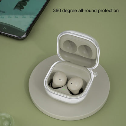 Glitter transparent TPU earbud case on charging base, holding two white earbuds