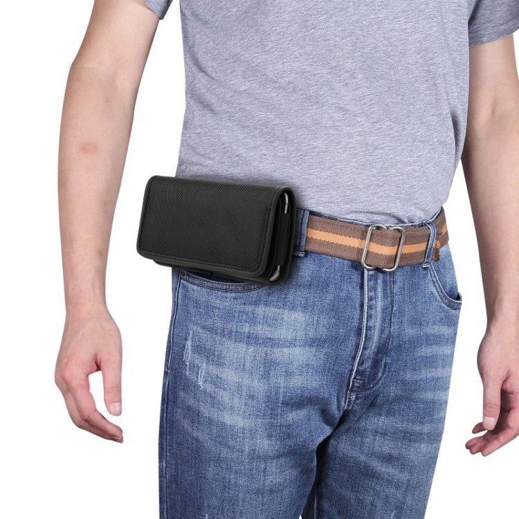 Universal black phone case worn on a belt on blue jeans
