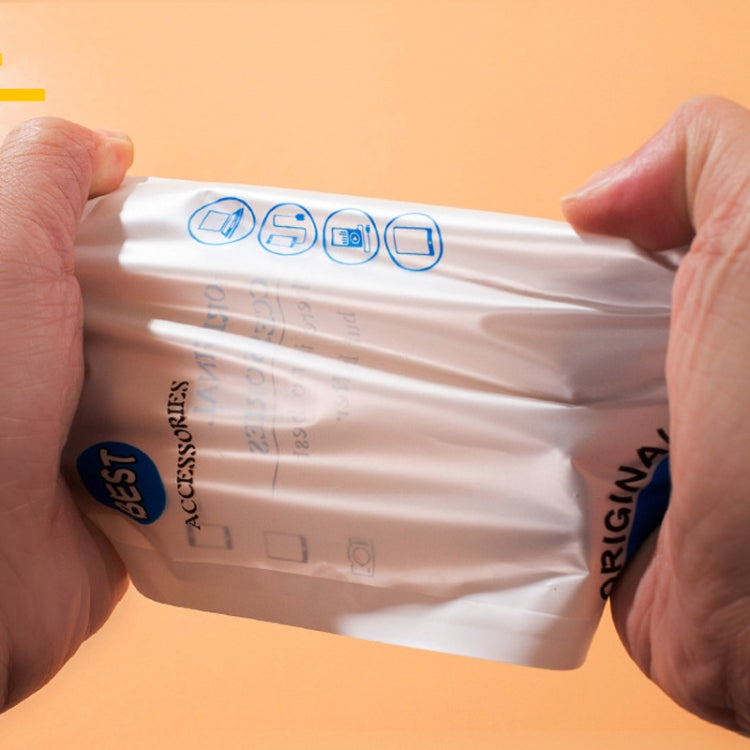 Sealed white accessories pouch with blue icons, held open by hands