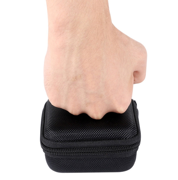 Black hard-shell storage bag with zipper top and textured exterior