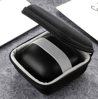Open black hard-shell earbuds case showing molded earbud holder and strap