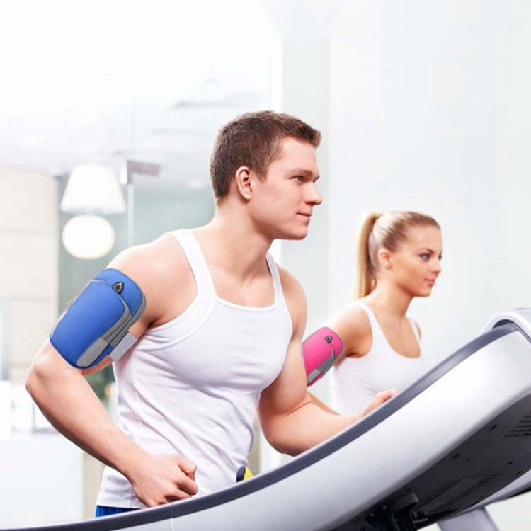 Runner wearing blue phone storage arm bag during fitness workout