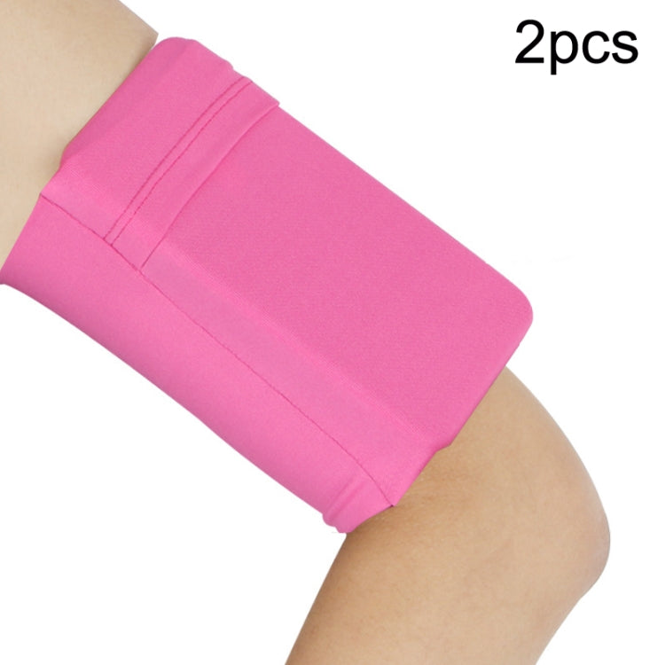 Pink elastic phone armband set with secure pocket on wearer’s arm (2-pack).