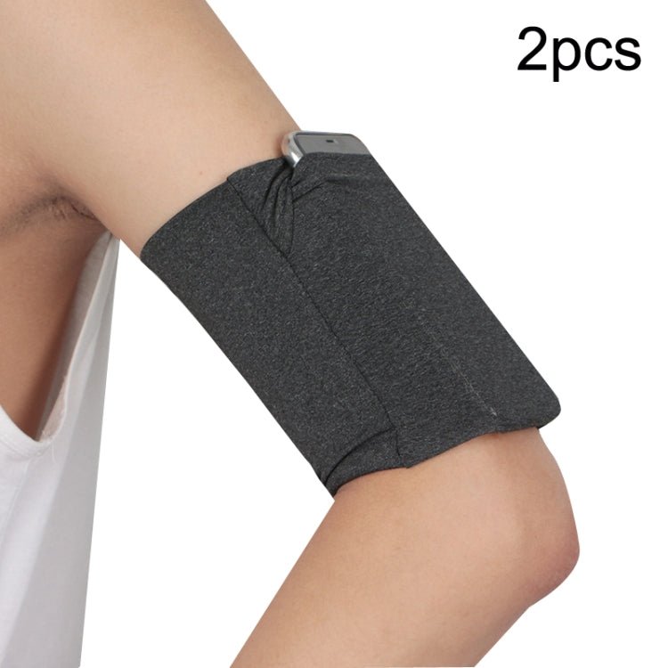 Dark gray elastic phone armband set with secure pocket on wearer’s arm (2-pack).