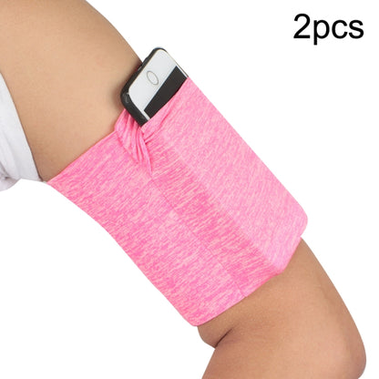 Pink elastic phone armband with secure holder, worn on an arm