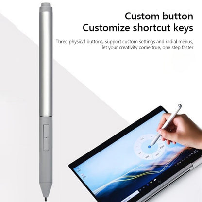 Gray stylus pen held in hand with tablet screen and side button area
