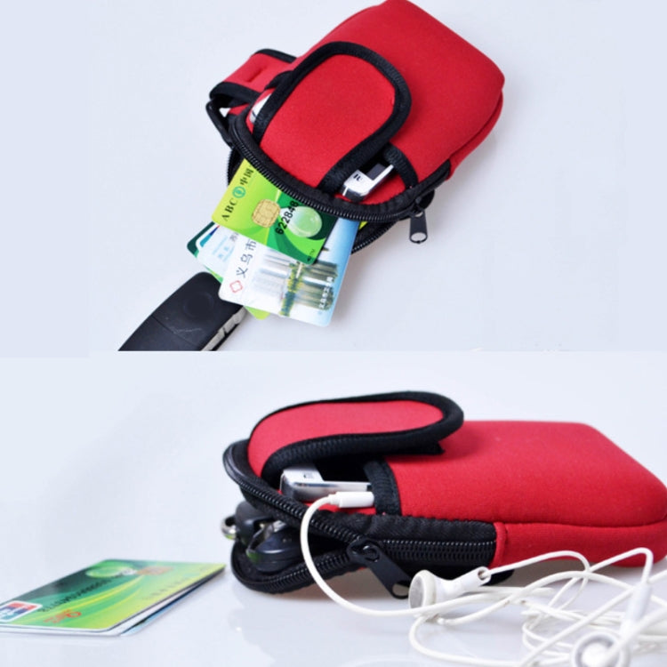 Red neoprene armband phone bag with black trim and zipper, cards and cable visible.