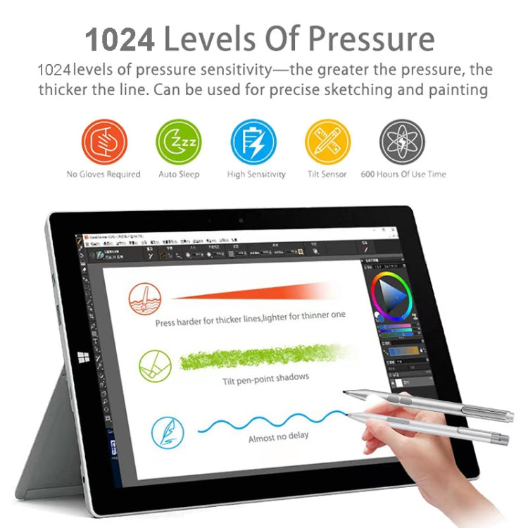 Silver electronic stylus pen with fine tip positioned above a tablet