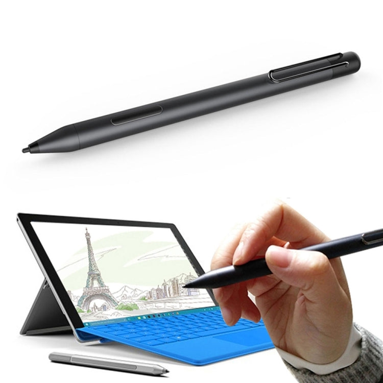 Black electronic stylus pen held in hand, fine tip ready to write