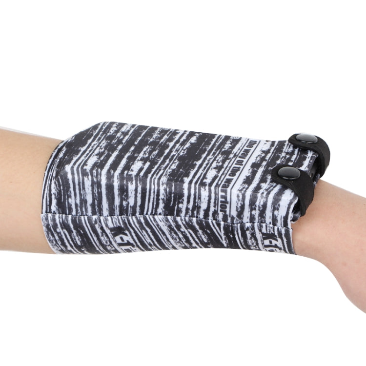 Black-and-white striped phone wrist bag with snap closure and elastic strap