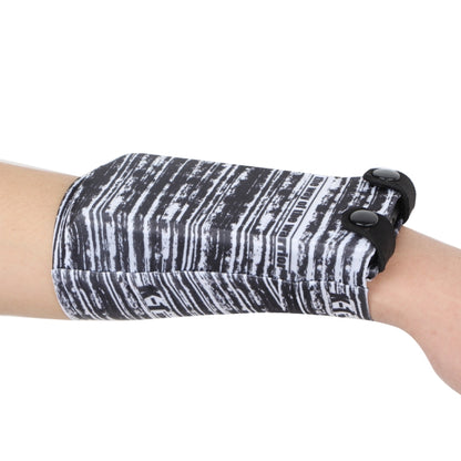 Black-and-white striped phone wrist bag with snap closure and elastic strap