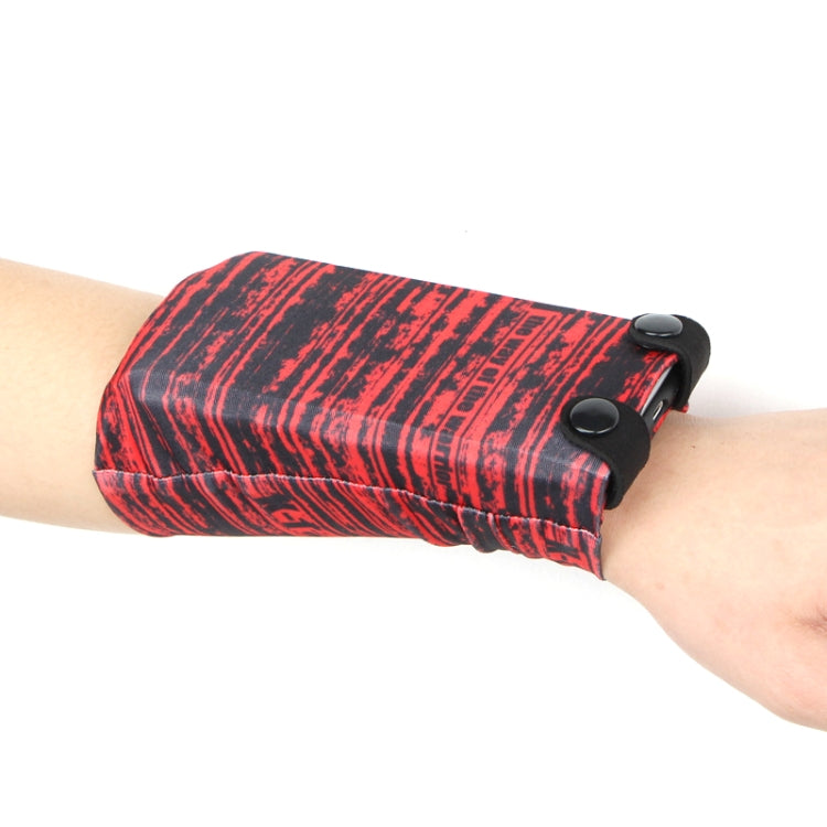 Red striped phone wrist bag with snap closure and elastic strap