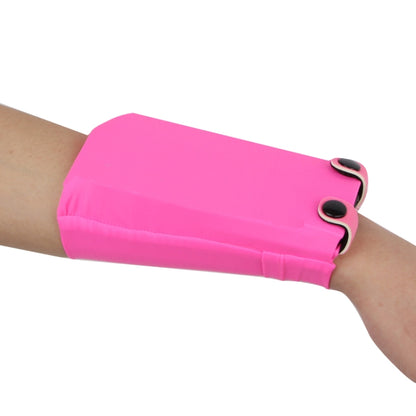 Pink solid phone wrist bag with snap closure and elastic strap