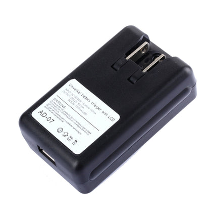 Black universal charger with label, side USB output, and US-style plug