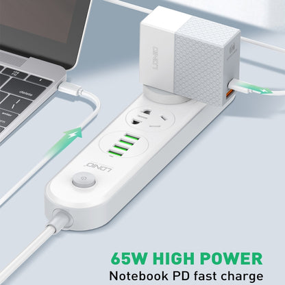 LDNIO 65W charger connected to a power strip with USB-A and USB-C ports
