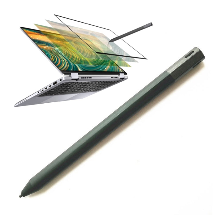 Dark green active stylus pen with pointed tip, placed near a laptop