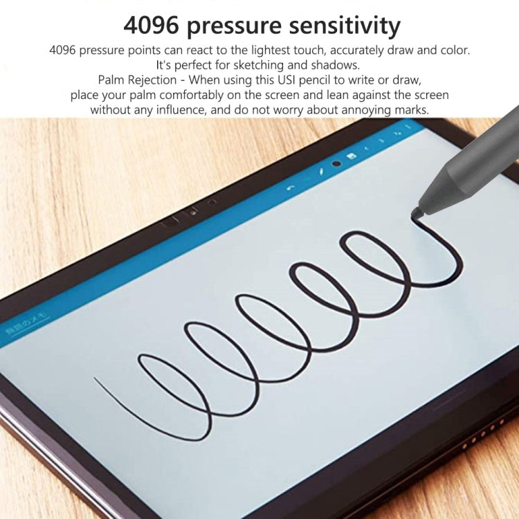 Stylus drawing gray curves on tablet screen, close-up of pen tip