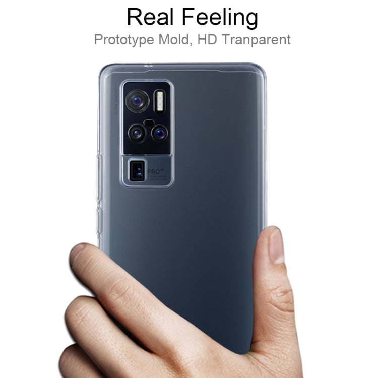Transparent TPU phone case for Vivo X50 Pro+ held in hand, camera cutout visible