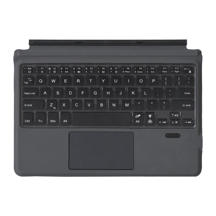 Dark Bluetooth keyboard layout with touchpad and function keys, top view