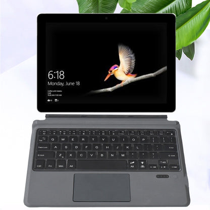 Folding Bluetooth keyboard with touchpad, dark keys under tablet stand