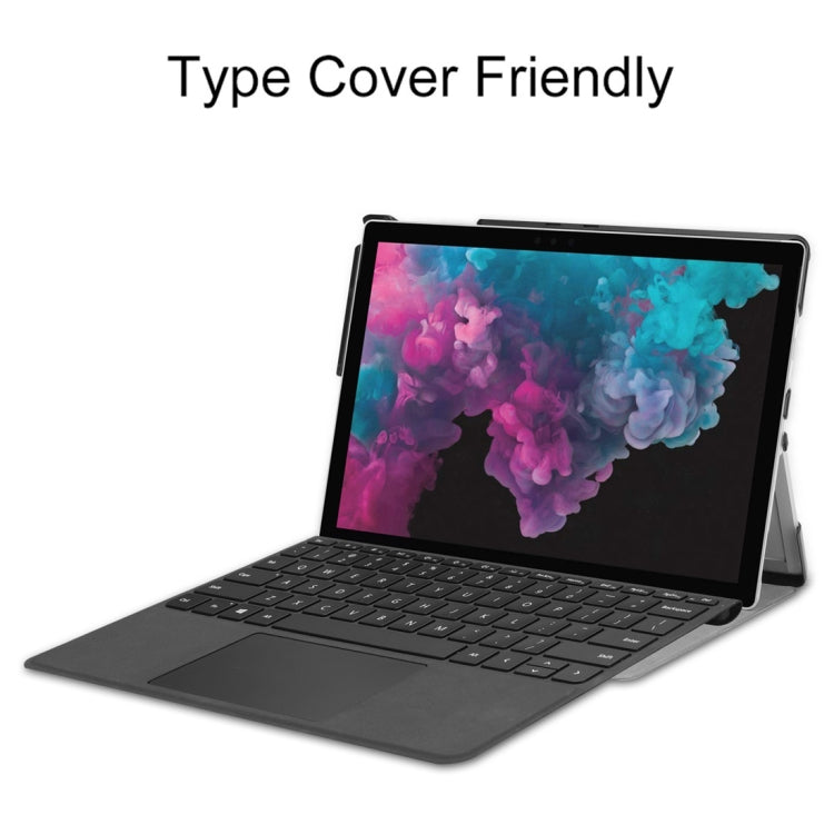 Grey PU leather flip case with open cover and tablet supported on stand