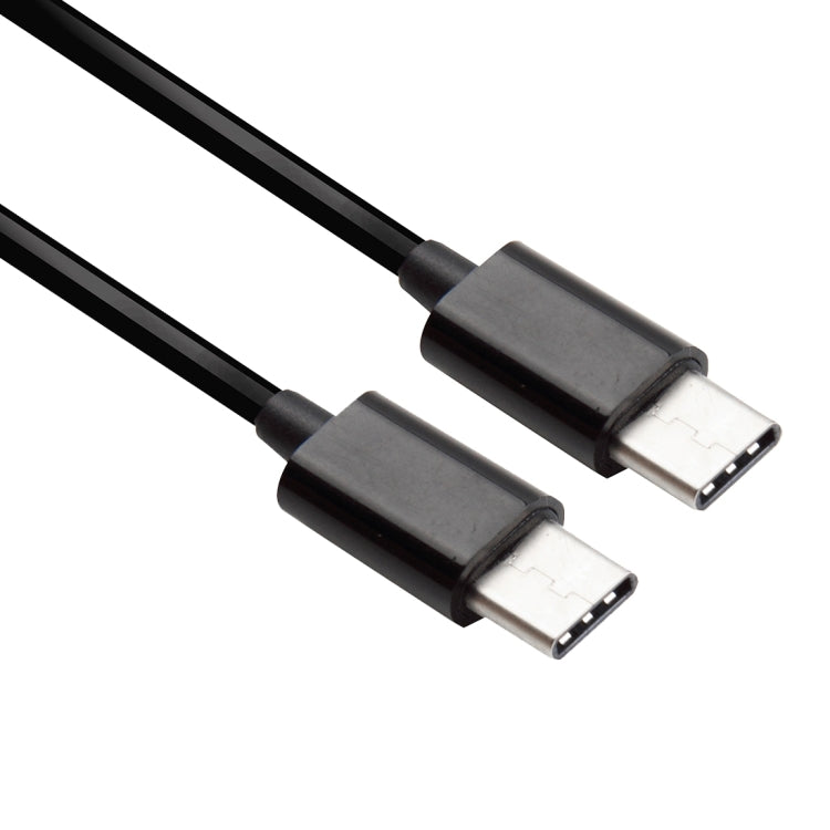 USB-C to USB-C male connector ends on black coiled spring charging cable