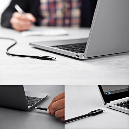 USB-C to USB-C coiled cable connected to a laptop for charging and data