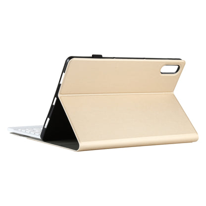 Gold-beige folio tablet case with integrated stand, keyboard detached