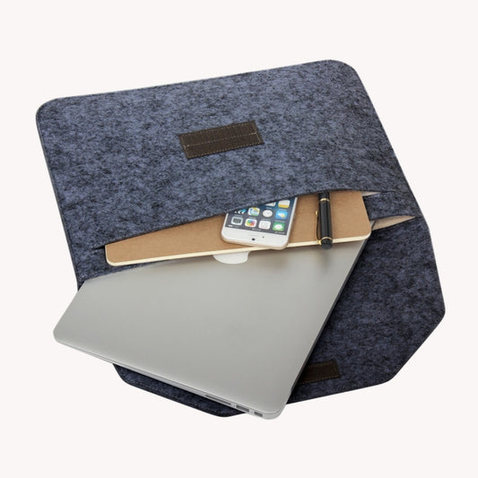 Grey felt sleeve bag with front leather patch, holding a laptop and tablet inside