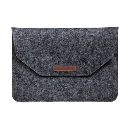 Grey felt tablet laptop sleeve with flap and brown leather-look logo patch