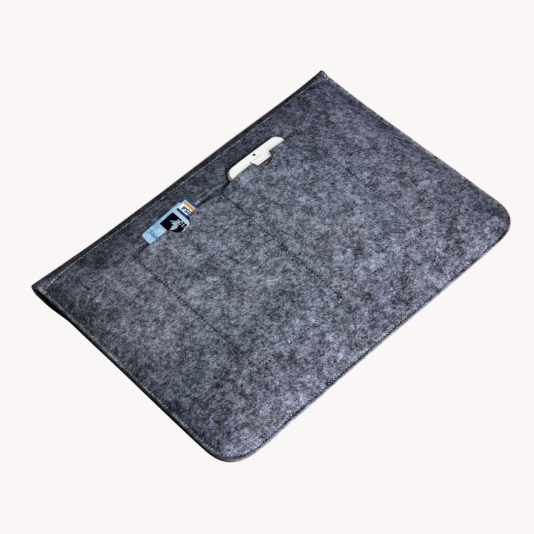Grey felt zippered sleeve bag with a small tag label near the top edge