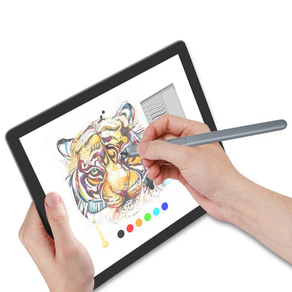 Gray stylus pen held to tablet screen for writing