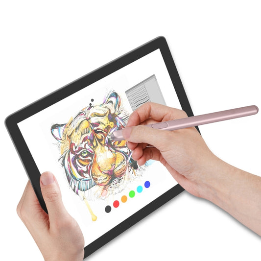 Pink stylus pen held over tablet screen for drawing