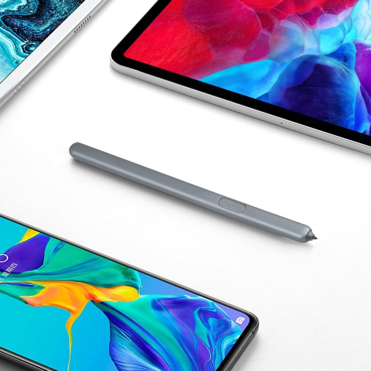 Gray stylus pen resting beside tablet screen