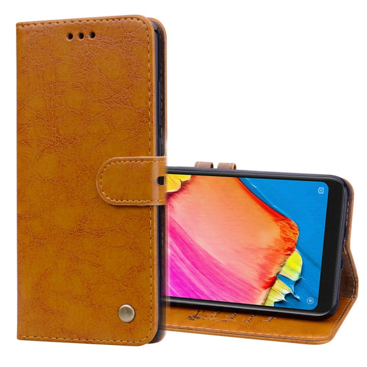 Light brown flip leather wallet case with card holder and magnetic snap, phone front view