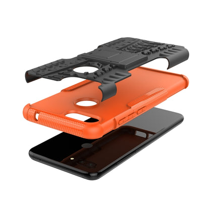 Rugged orange phone case with flip-out holder plate and side camera openings