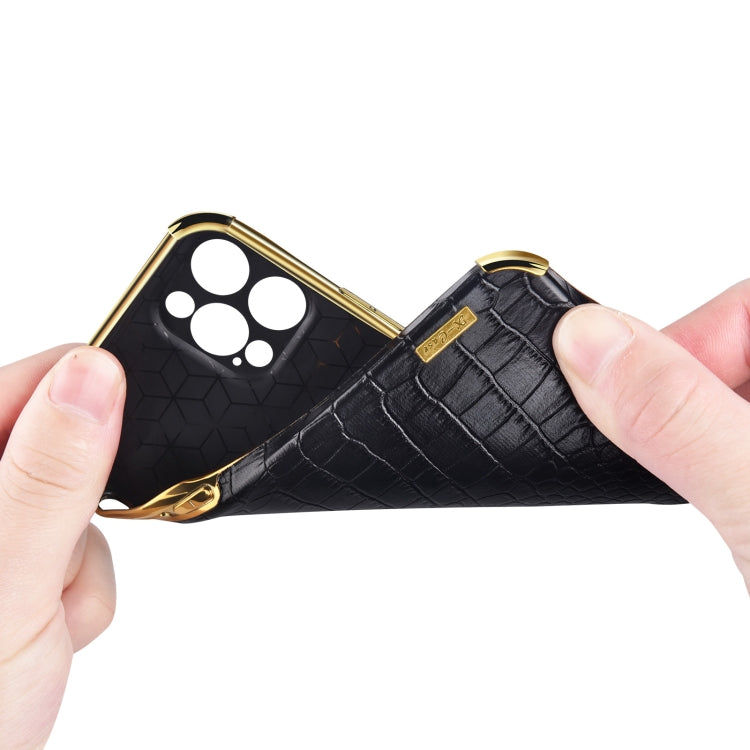 Black crocodile-pattern phone case with gold edges and camera cutouts