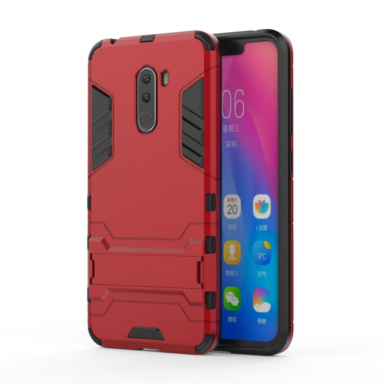 Red shockproof phone case with holder, textured black panels and camera cutout