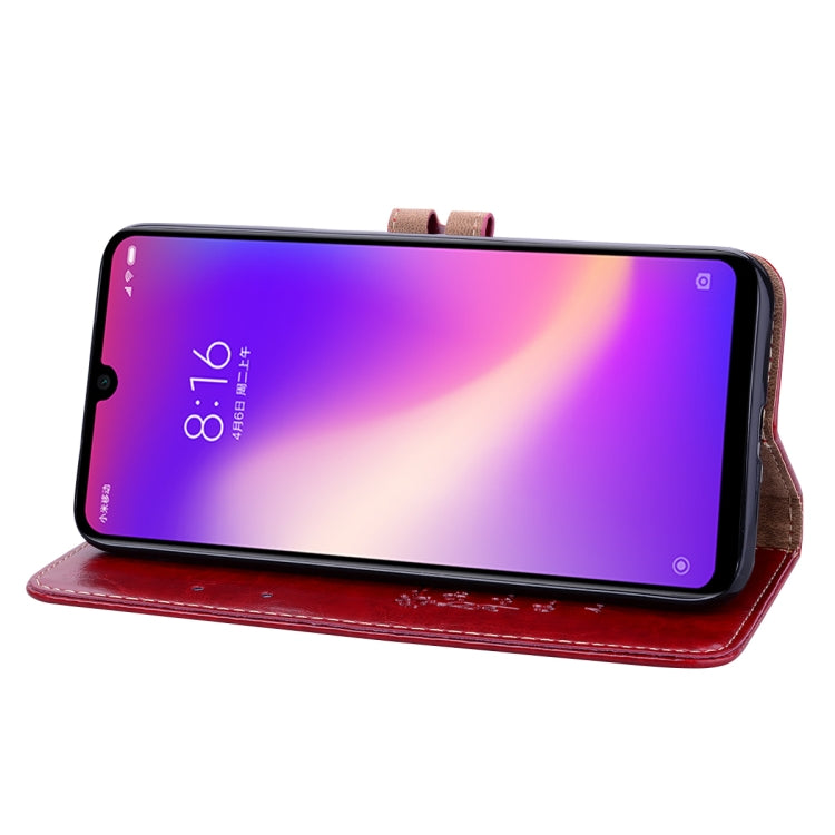 Flip leather wallet phone case for Xiaomi Redmi 7, red, holding phone in landscape