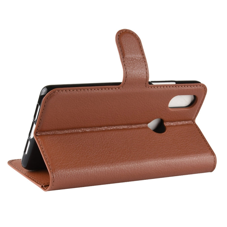 Brown flip leather folio phone case with side strap and magnetic flap