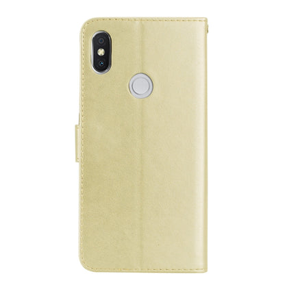 Gold PU leather phone case with rose embossing, camera cutout, and button port