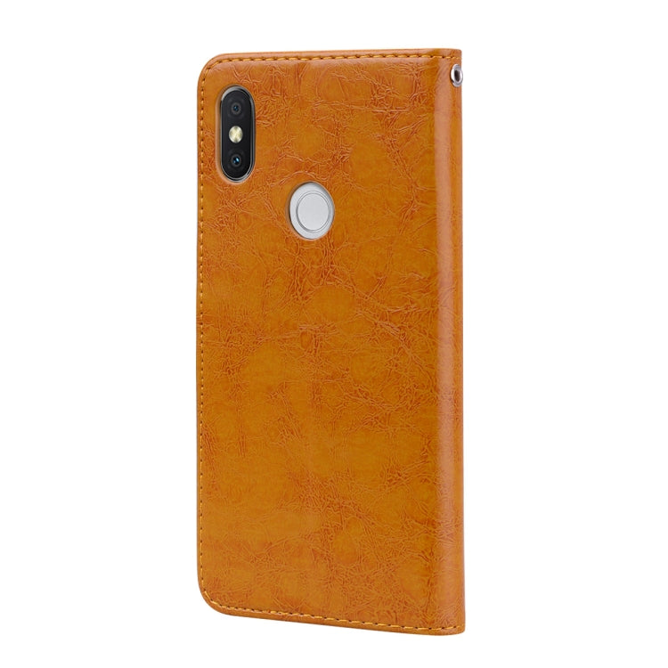Brown oil-wax textured leather flip cover with camera cutout and speaker holes